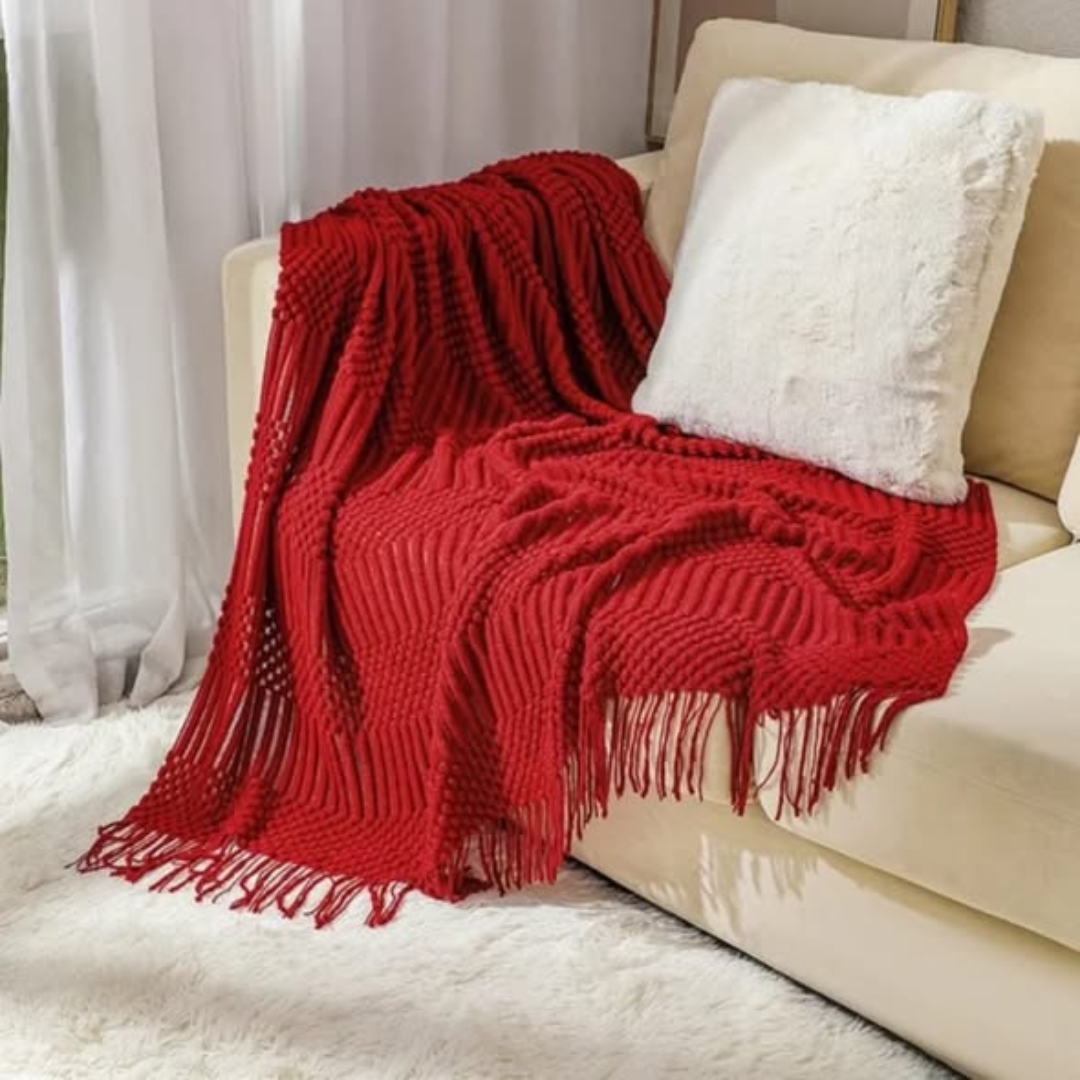 Knitted throw blanket with tassels
